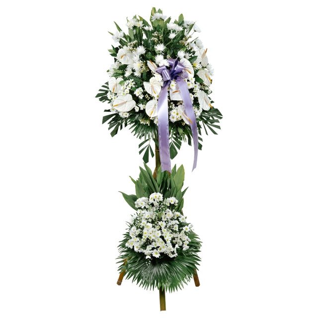 White Condolence Flowers funeral stand with anthurium and greenery